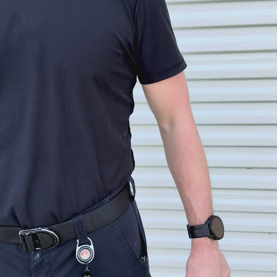 Video of firefighter wearing The Stink Stick reel clipped to his belt loop, stretching the retractable extender in three directions, which then automatically reels back in